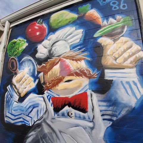 mural at Tossed 2 Go's location of the Swedish Chef Muppet with salad ingredients